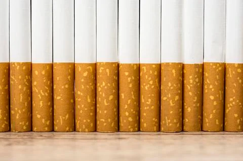 Raw of cigarettes background Stock Photos
