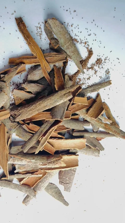Raw cinnamon bark pieces on white background, close-up Stock Footage 336471113