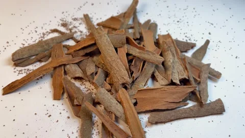 Raw cinnamon bark pieces on white background, close-up Stock Footage 336471115