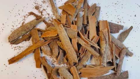Raw cinnamon bark pieces on white background, close-up Stock Footage 336471117