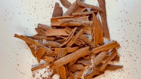 Raw cinnamon bark pieces on white background, close-up Stock Footage 336471118
