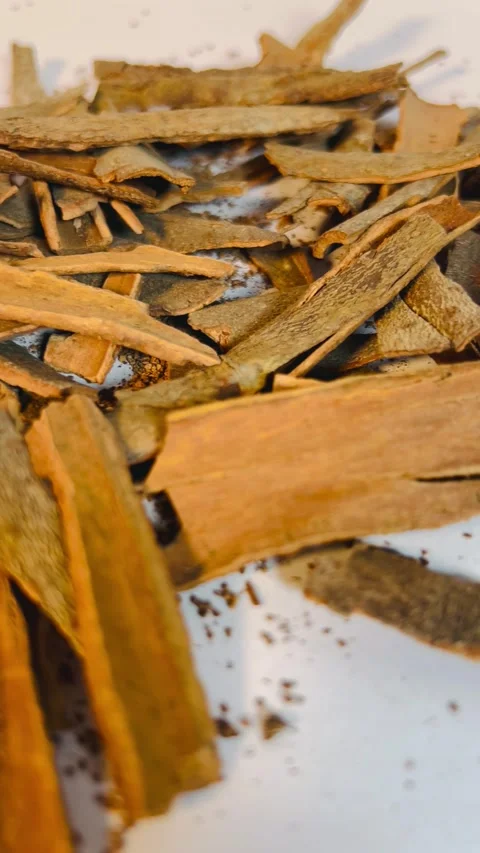 Raw cinnamon bark pieces on white background, close-up Stock Footage 336471119