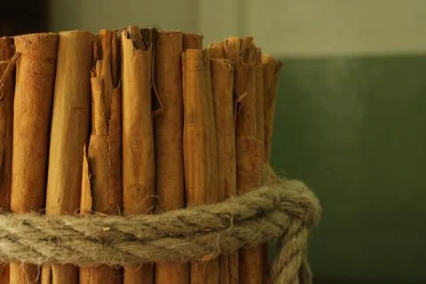 Raw Cinnamon bundle tied with rope - cinnamon factory Stock Photos