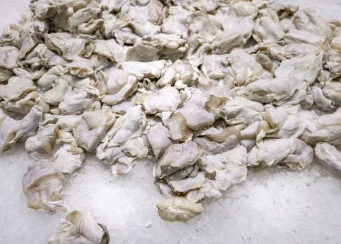 Raw cod cheeks in a fish market, fish trade and sale Stock Photos
