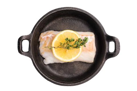 Raw cod fish fillets, whitefish without skin in skillet isolated on white b.. Stock Photos