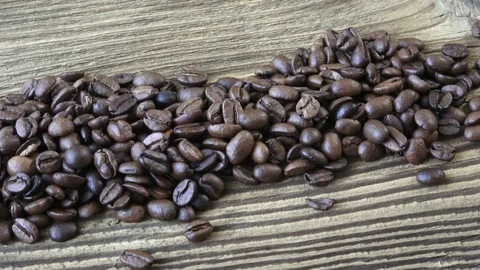 Raw coffee beans. Coffee beans on wood background. Stock Footage 82222543