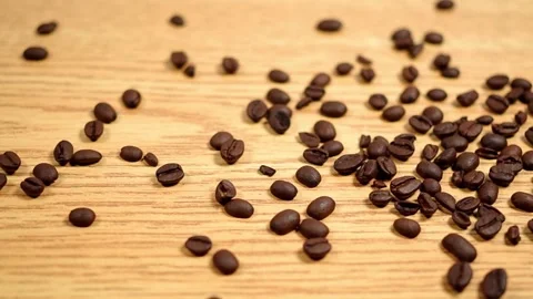 Raw Coffee Beans Spilling Across A Table Stock Footage 141639470