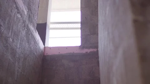 Raw Concrete Corner Below a Bright Window, Building Interior, Low Angle Shot Vidéo 341572507