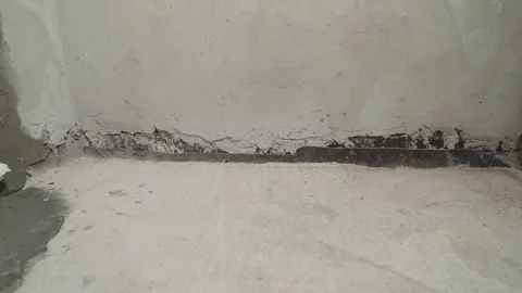 Raw concrete floor and wall corner during construction with waterproofing Stock Footage 329933430