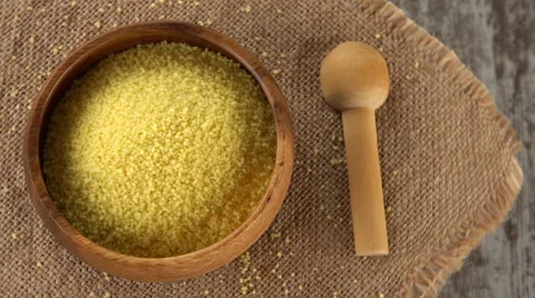 Raw couscous on burlap rotating. Seamless loopable. 4K Stock Footage 67553213