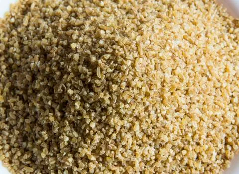 Raw couscous texture Stock Photos
