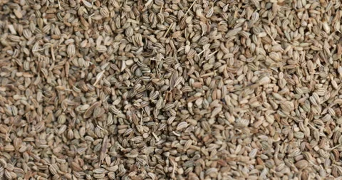 Raw cumin seeds displayed in bulk at a local market Stock Footage 324202519