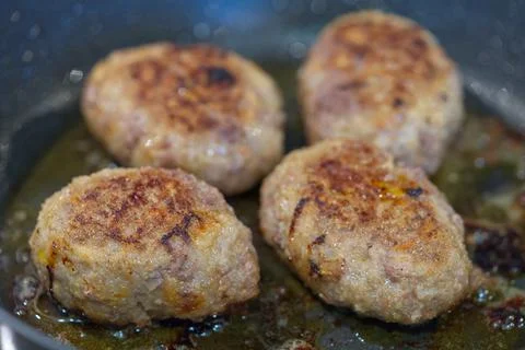 Raw cutlets made of ground beef meat. coocking process Stock Photos