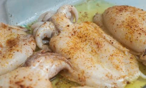 Raw cuttlefish with spices Stock Photos