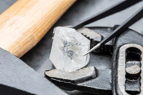 Raw diamond big dob between different tools hard to process Stock Photos