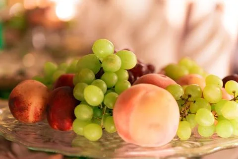 Raw different fruit on the plate, close up Stock Photos