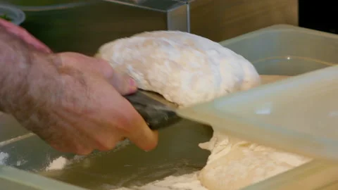 Raw dough in a baking dish. Stock Footage 159338165