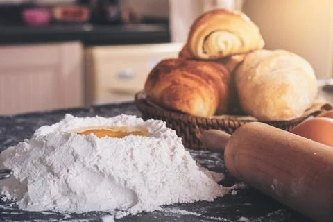 Raw dough for bread with ingredients on black background Stock Photos