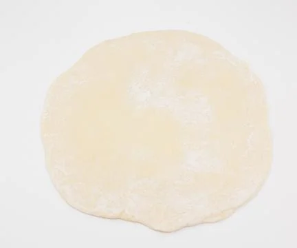 Raw Dough Round Disk On White Background Ready For Baking Stockfoto's