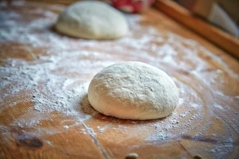 Raw dough on the table at home Stock Photos