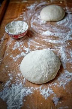 Raw dough on the table at home Stock Photos