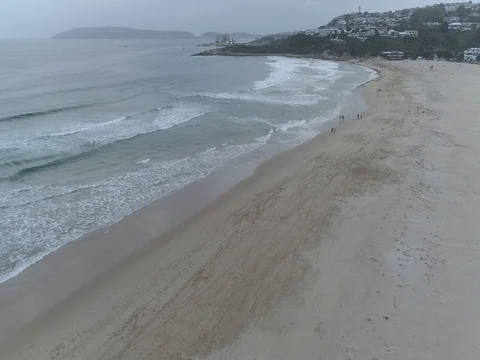 Raw drone shot over beach towards beacon isle 스톡 동영상 76247945