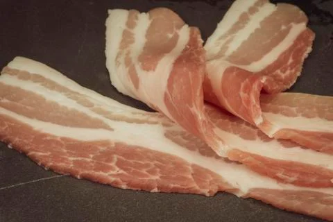 Raw dry-cured back bacon Stock Photos
