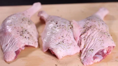 Raw duck legs on a kitchen table. Stock Footage 146138477