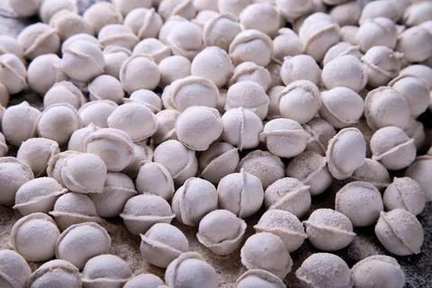 Raw dumplings background on a dark background Stock Photos