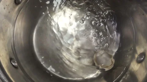 Raw dumplings falling into water in slow motion Stock Footage 140222308