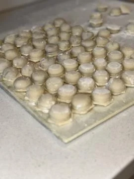 Raw Dumplings on Floured Surface 写真素材