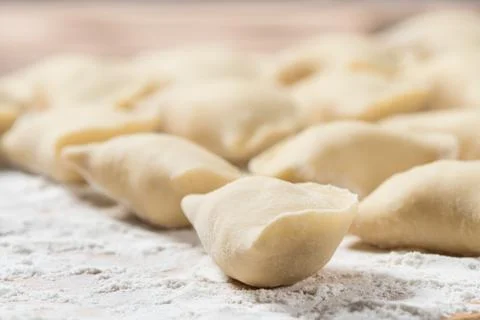 Raw dumplings ready to boil, close up. Also known as Vareniks, Ukrainian trad Fotos Stock