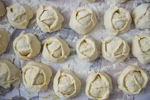 Raw dumplings on the table Stock Photos