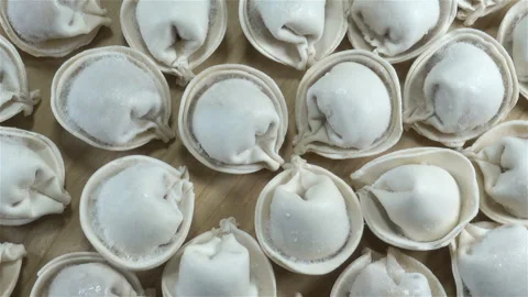 Raw dumplings us background Stock Footage 148102195