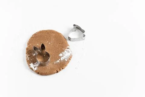 Raw easter gingerbread dough with cutters and flour. Preparation of Easter .. Stock Photos