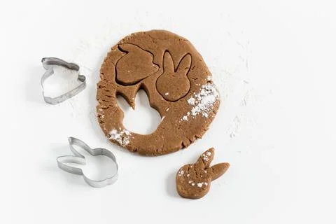 Raw easter gingerbread dough with cutters and flour. Preparation of Easter .. Stock Photos