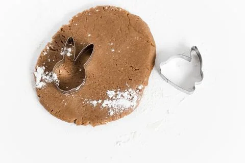 Raw easter gingerbread dough with cutters and flour. Preparation of Easter .. Stock Photos