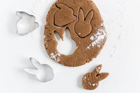 Raw easter gingerbread dough with cutters and flour. Preparation of Easter .. Stock Photos