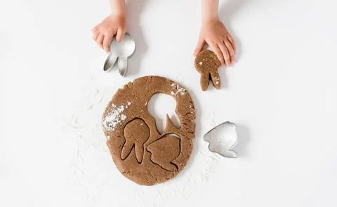 Raw easter gingerbread dough with cutters and flour. Preparation of Easter .. Stock Photos