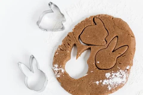Raw easter gingerbread dough with cutters and flour. Preparation of Easter .. Stock Photos