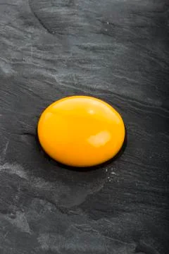 Raw egg close-up on black background Stock Photos