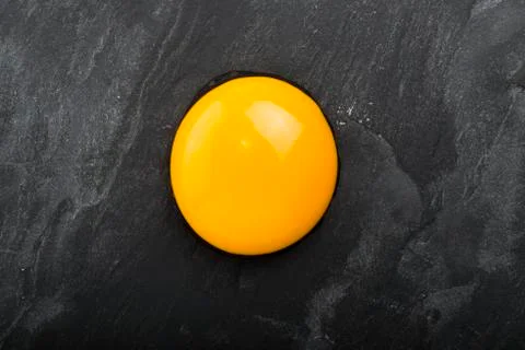 Raw egg close-up on black background Stock Photos