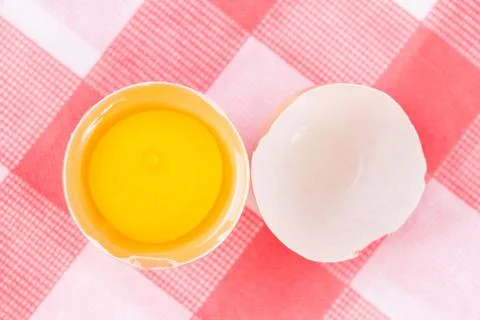 Raw egg on egg shell Stock-Fotos