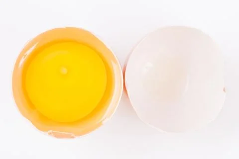Raw egg on egg shell Stock Photos