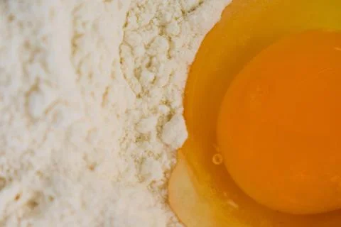 Raw Egg in Flour Well for Baking Preparation, Top View Stock Photos