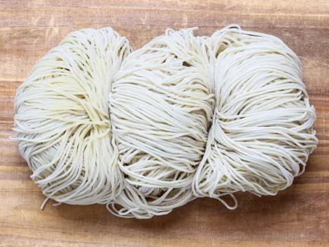 Raw egg noodles Stock Photos