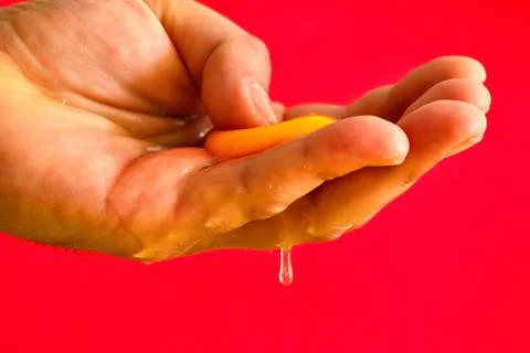 A raw egg open in the end Stock Photos