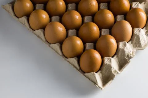 Raw Egg on package Stock Photos