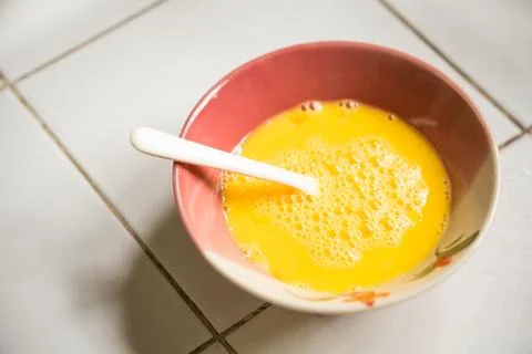 Raw egg prepared for omelet Stock Photos