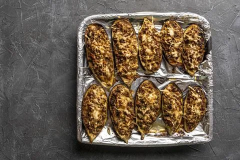 Raw eggplant with meat on a baking sheet Stock Photos